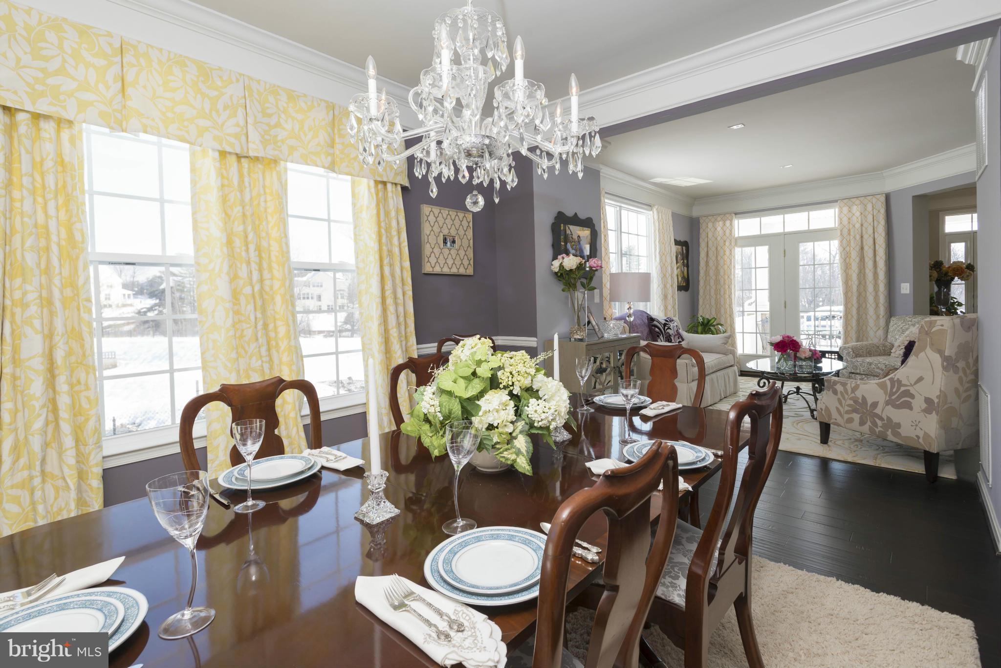 2302 Winterwood Road Baltimore, MD 21209 - Photo 6 of 30 a view of a dining room with furniture and chandelier