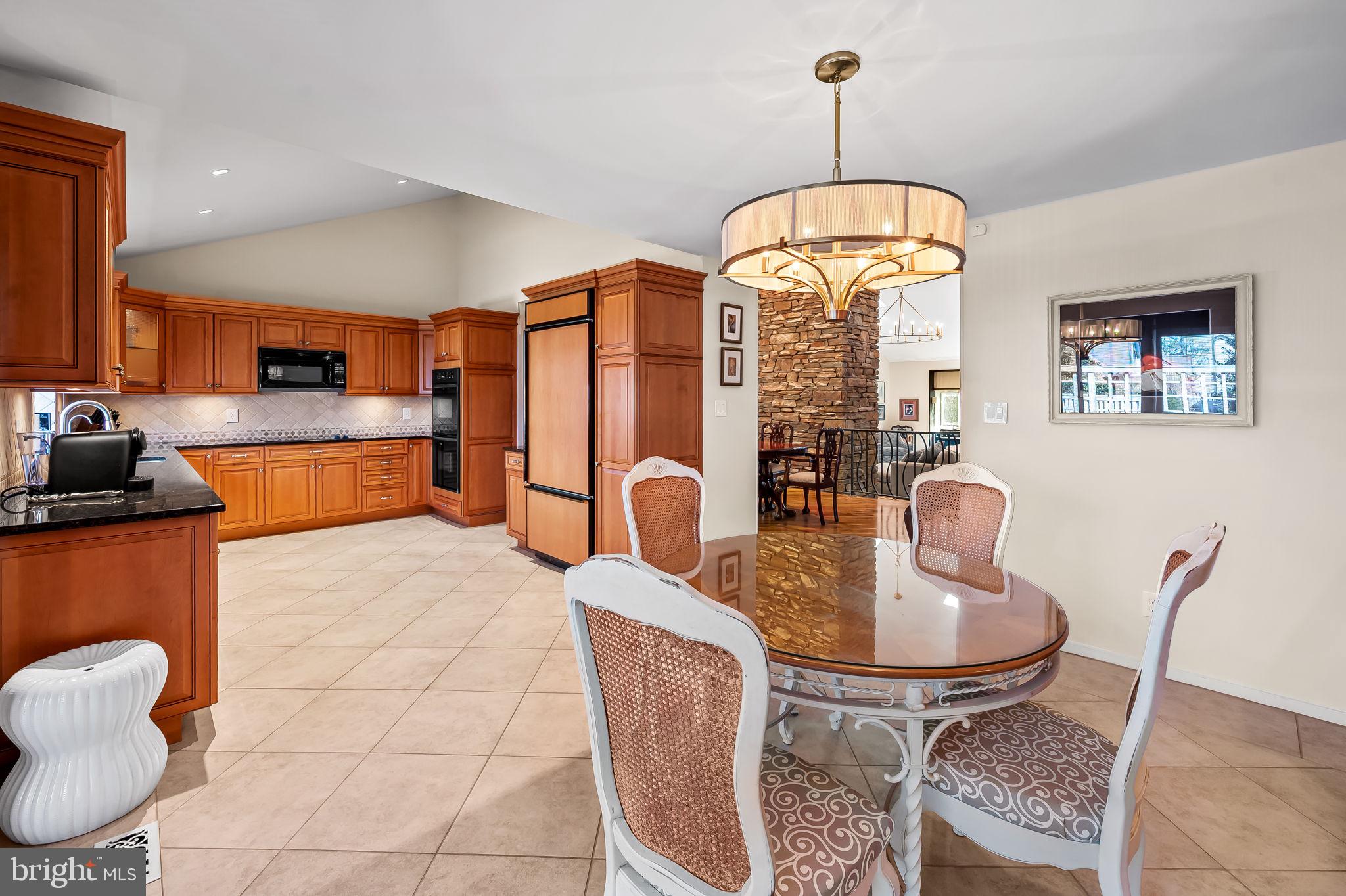 8014 Melody Lane, Unit 8014 Baltimore, MD 21208 - Photo 11 of 51 a dining room with furniture and window