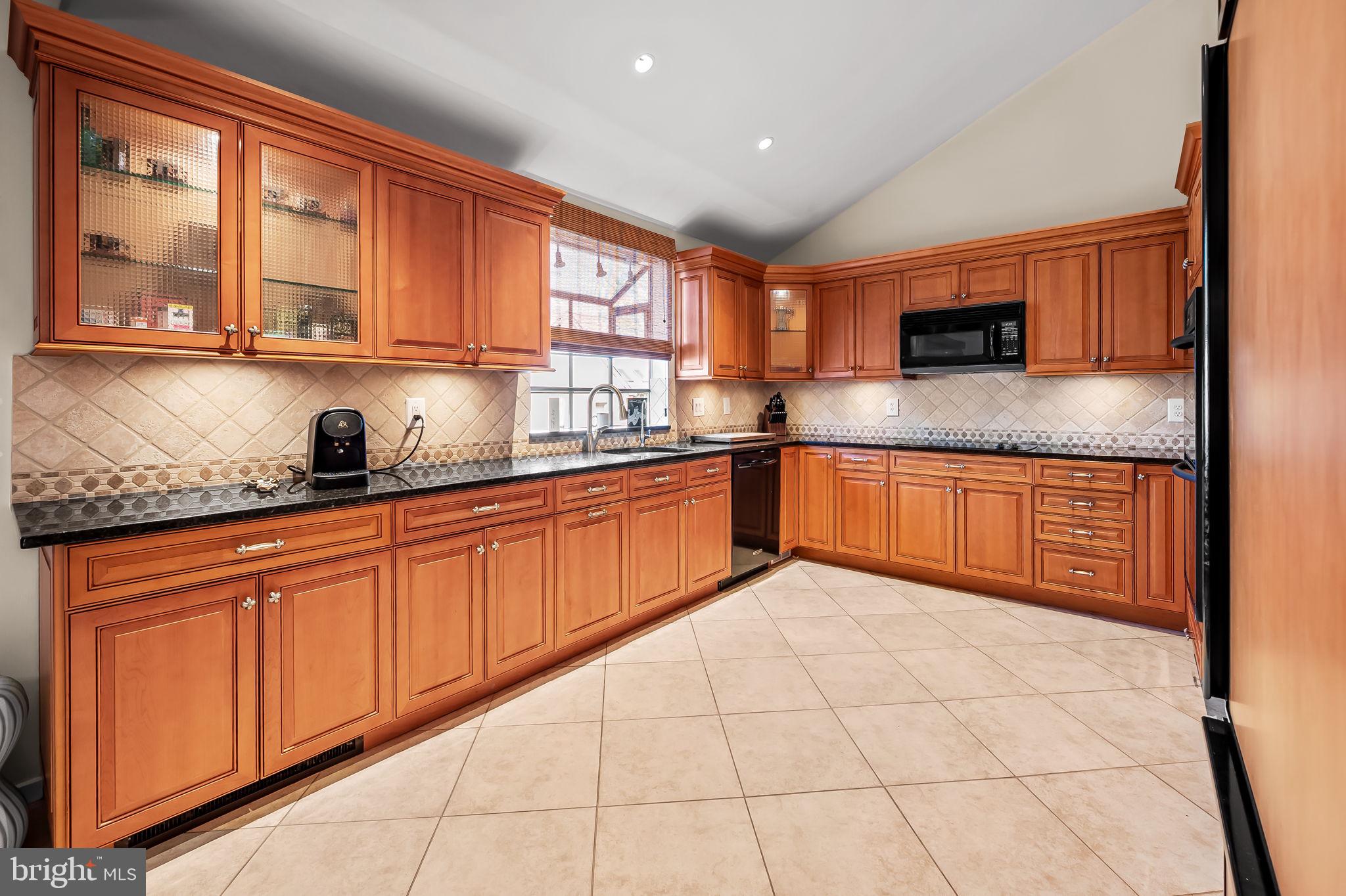 8014 Melody Lane, Unit 8014 Baltimore, MD 21208 - Photo 12 of 51 a kitchen with stainless steel appliances granite countertop a sink and cabinets