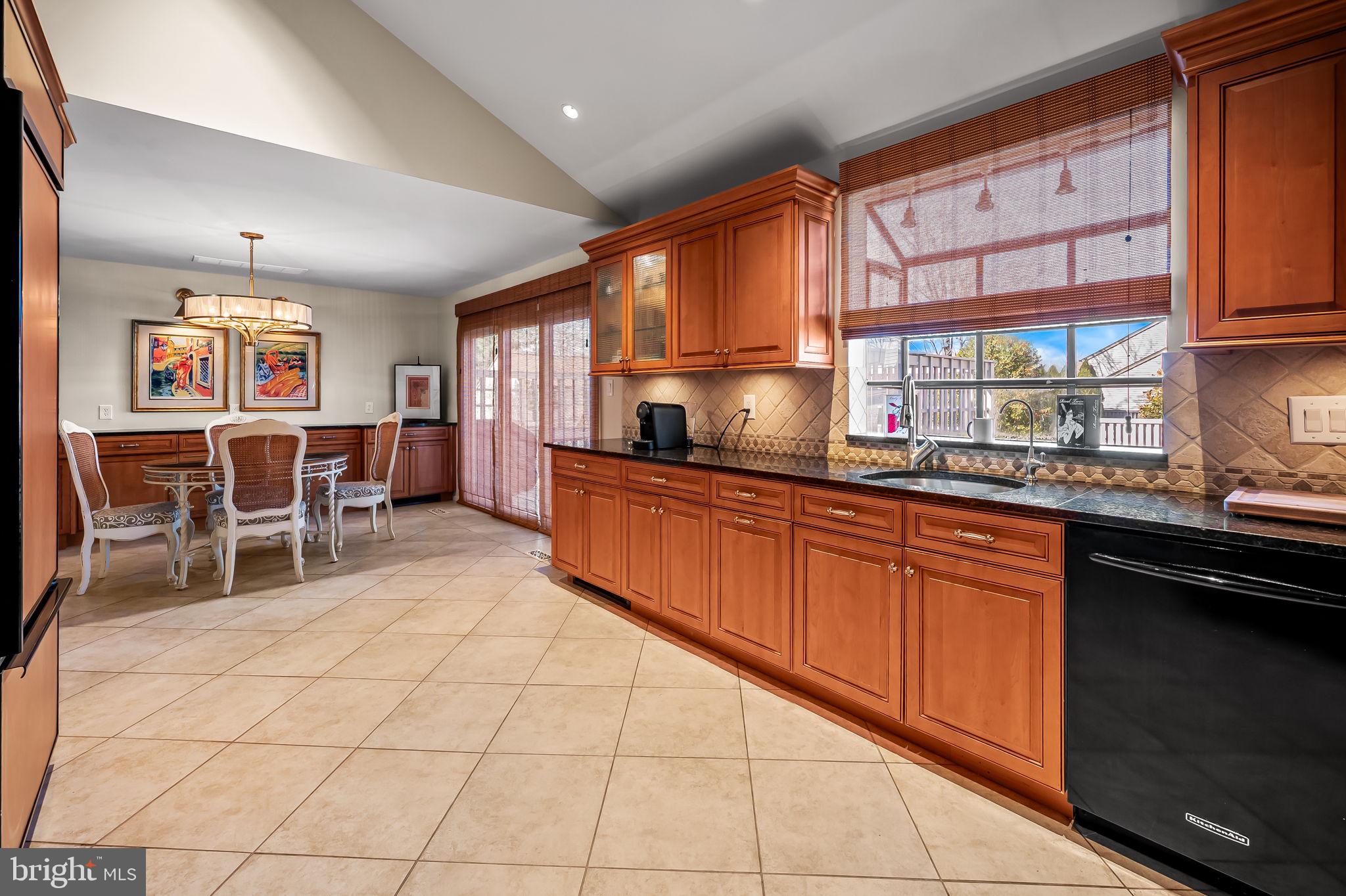 8014 Melody Lane, Unit 8014 Baltimore, MD 21208 - Photo 16 of 51 a kitchen with stainless steel appliances a sink and cabinets