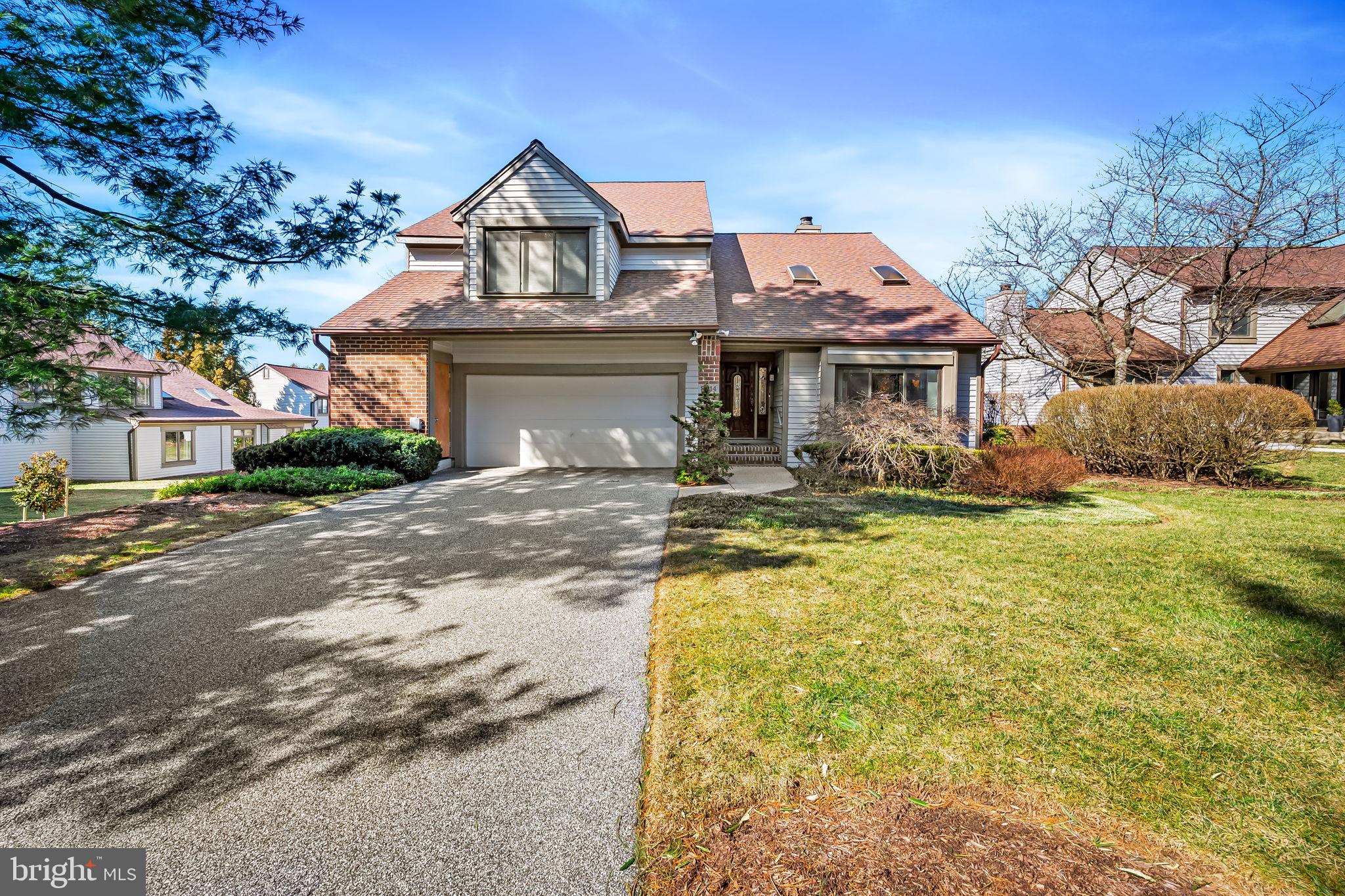 8014 Melody Lane, Unit 8014 Baltimore, MD 21208 - Photo 2 of 51 a front view of a house with a yard