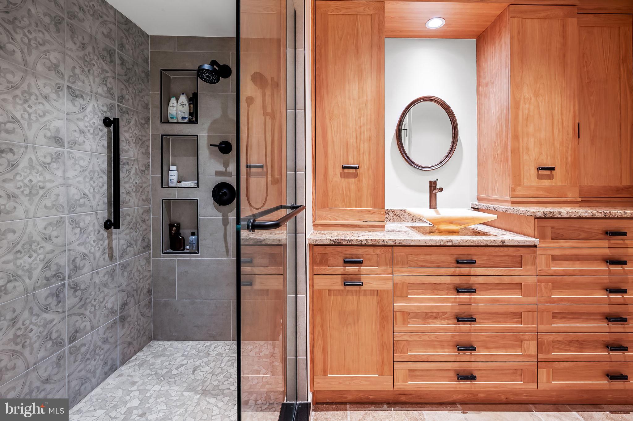 8014 Melody Lane, Unit 8014 Baltimore, MD 21208 - Photo 24 of 51 a bathroom with a sink a vanity and a mirror