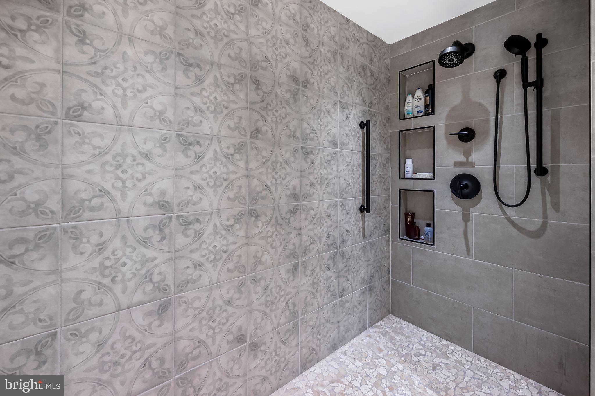 8014 Melody Lane, Unit 8014 Baltimore, MD 21208 - Photo 25 of 51 a bathroom with a glass shower door