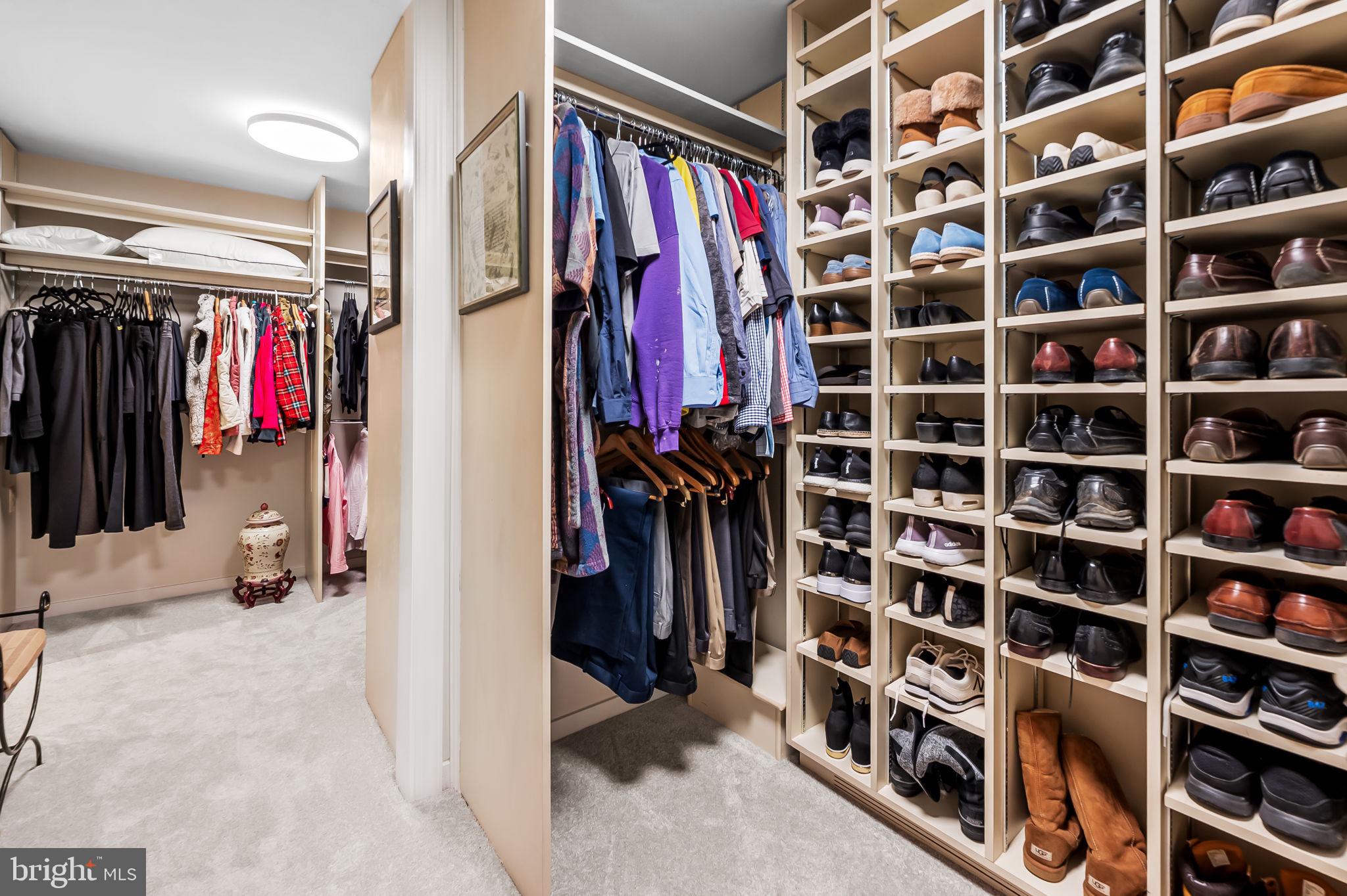 8014 Melody Lane, Unit 8014 Baltimore, MD 21208 - Photo 27 of 51 a view of walk in closet with clothes and shoes