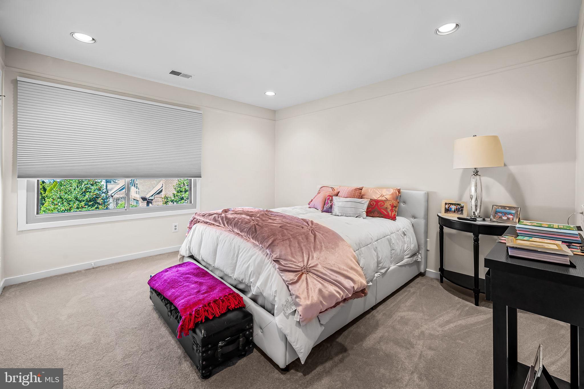 8014 Melody Lane, Unit 8014 Baltimore, MD 21208 - Photo 28 of 51 a bedroom with a bed and a lamp