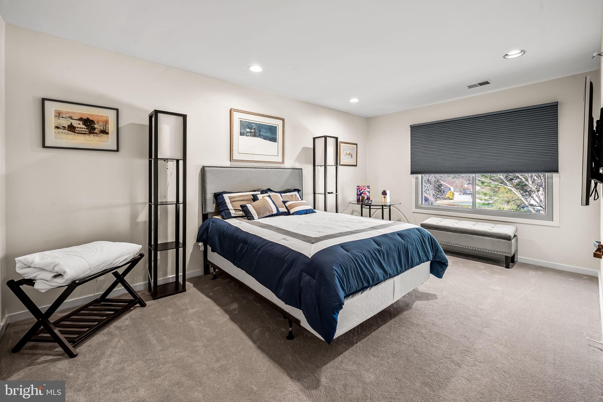 8014 Melody Lane, Unit 8014 Baltimore, MD 21208 - Photo 30 of 51 a bedroom with a bed chair and window