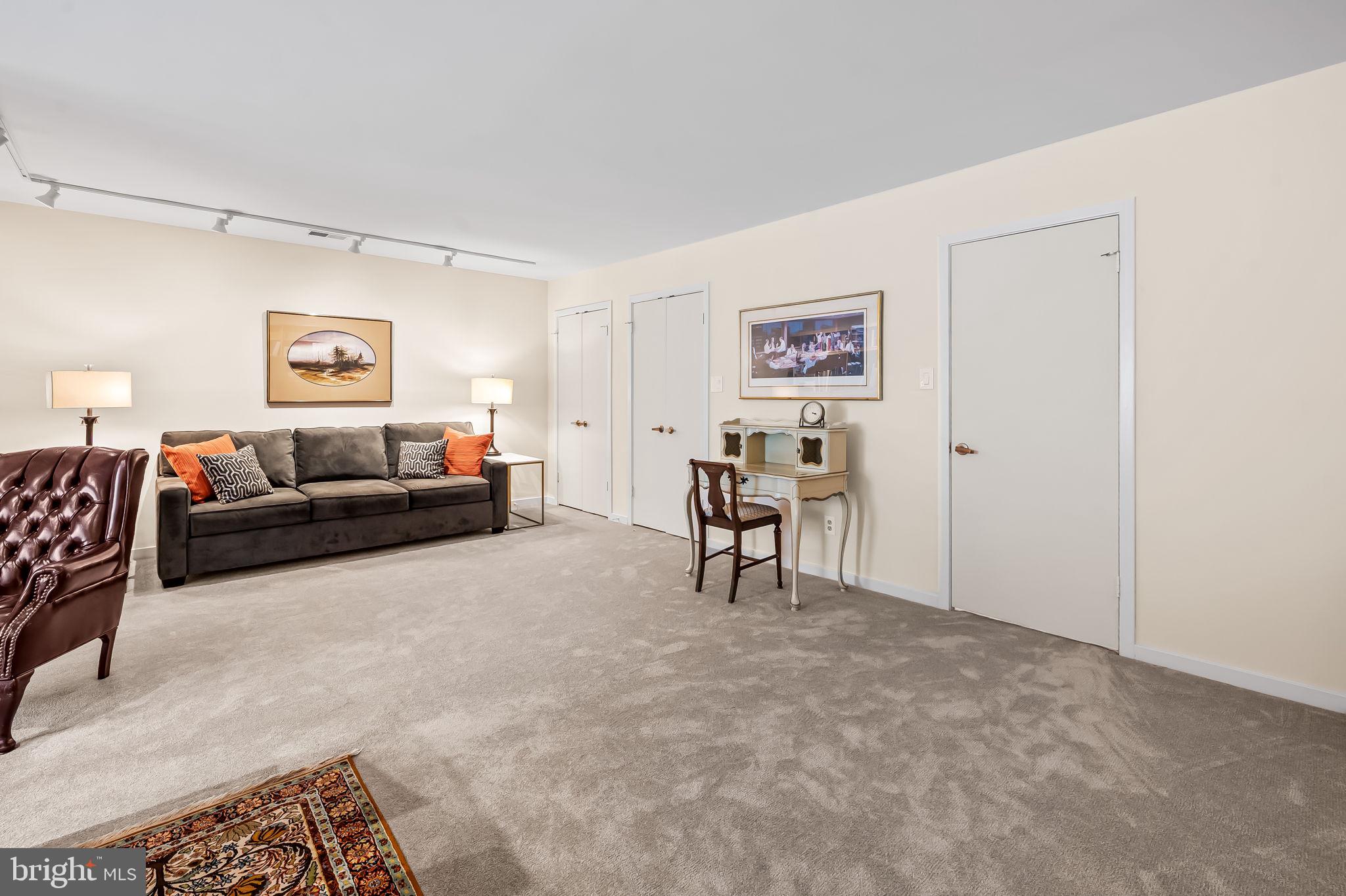 8014 Melody Lane, Unit 8014 Baltimore, MD 21208 - Photo 36 of 51 a bed room with furniture and a window