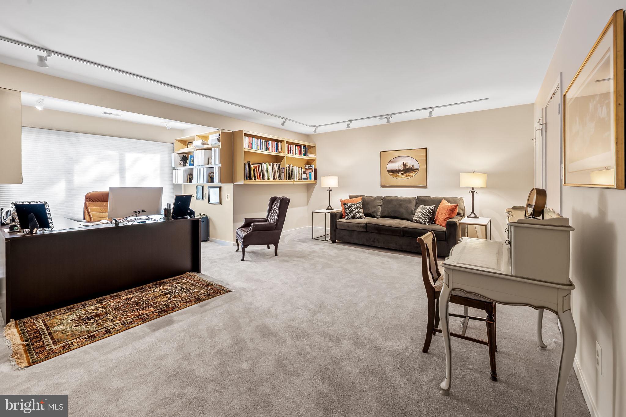 8014 Melody Lane, Unit 8014 Baltimore, MD 21208 - Photo 37 of 51 a living room with furniture and a flat screen tv