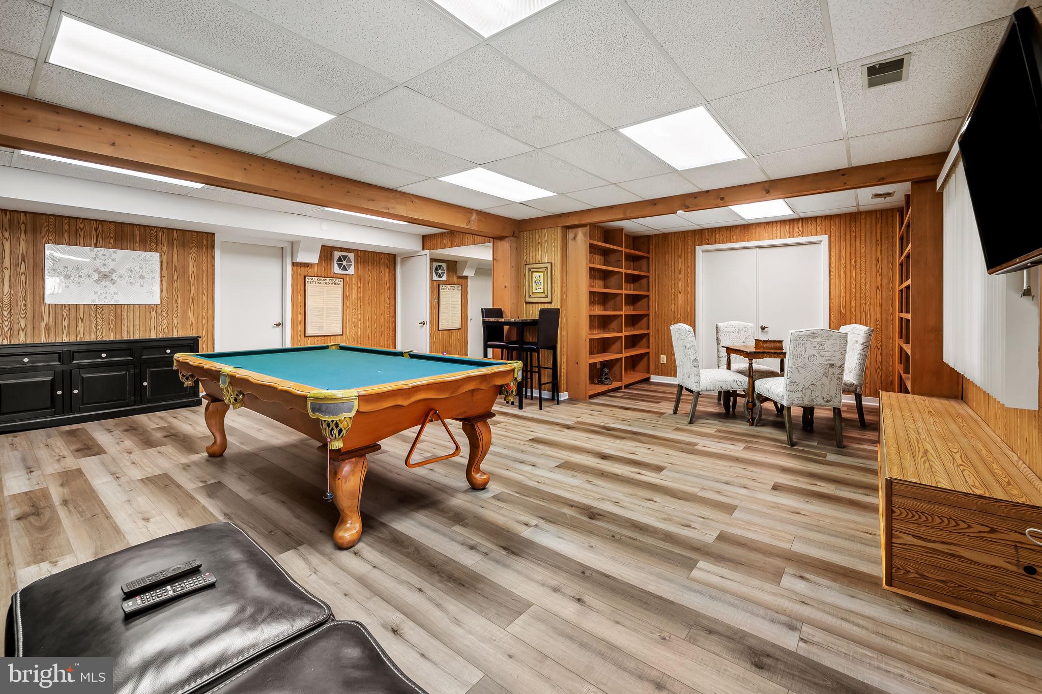 8014 Melody Lane, Unit 8014 Baltimore, MD 21208 - Photo 40 of 51 a room with furniture pool table flat screen tv and windows