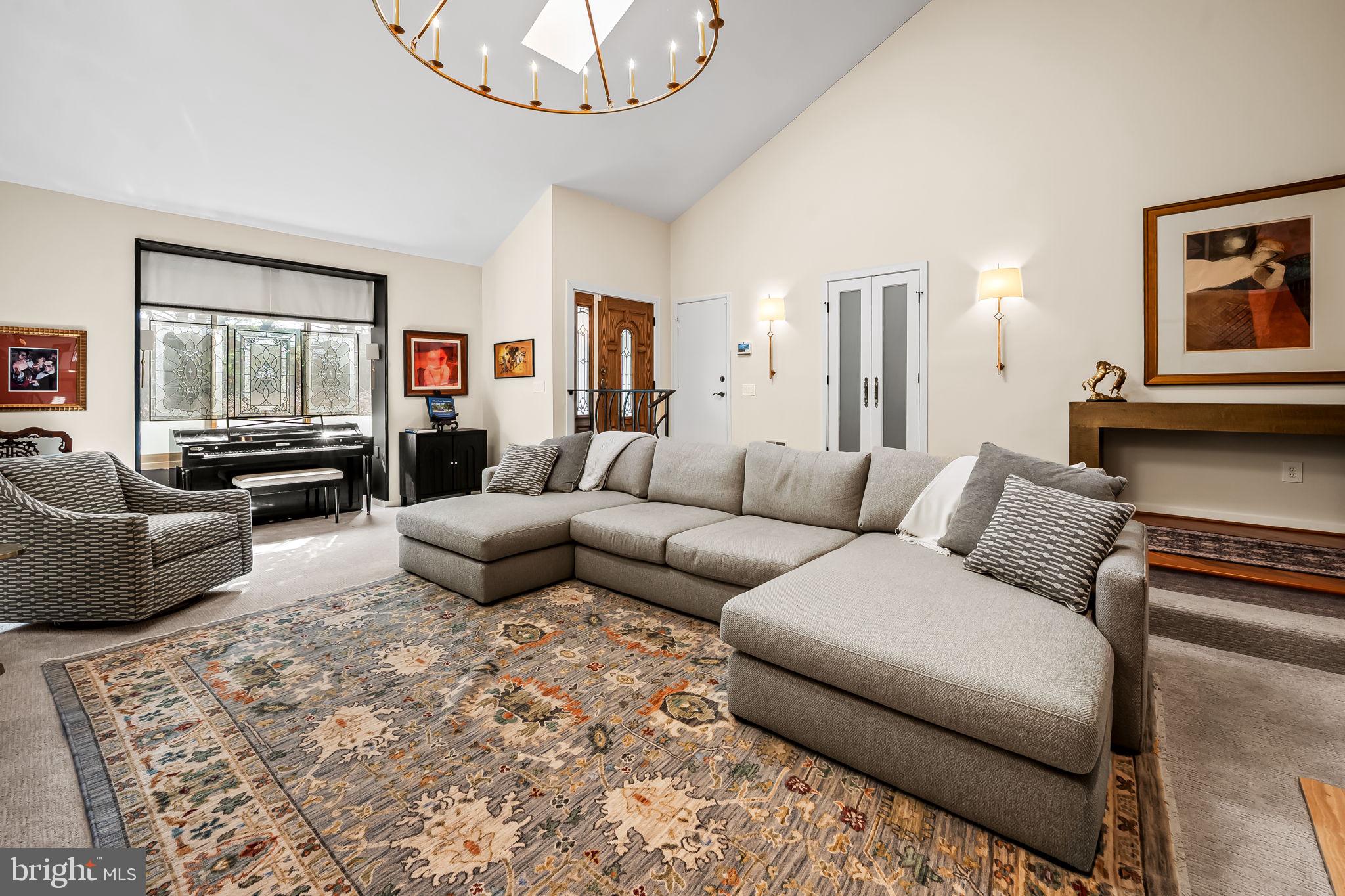 8014 Melody Lane, Unit 8014 Baltimore, MD 21208 - Photo 4 of 51 a living room with furniture and a flat screen tv