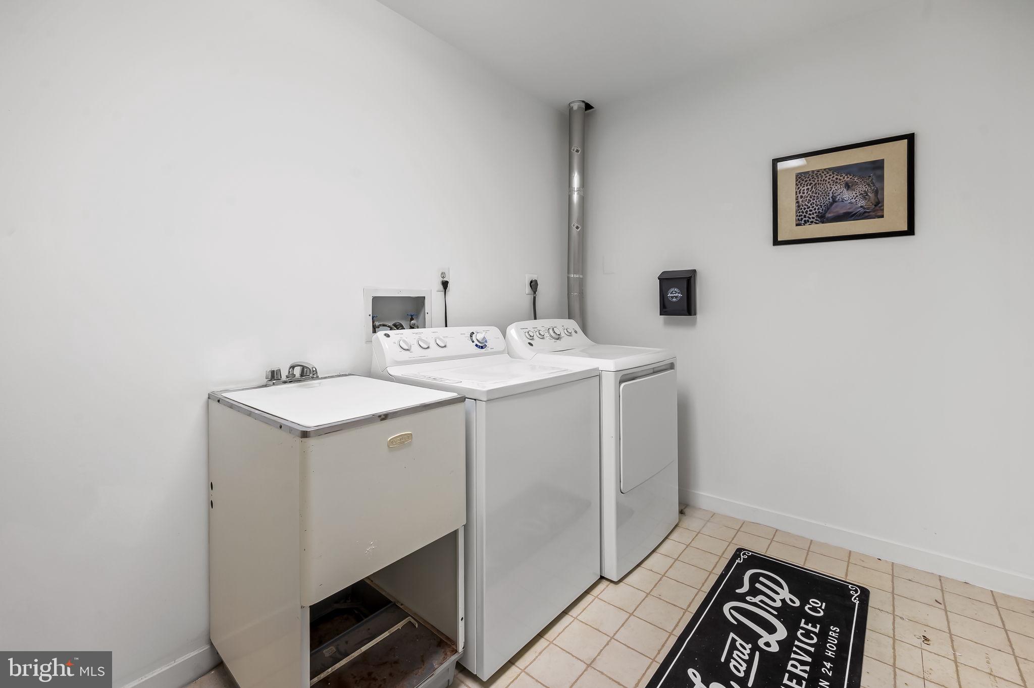 8014 Melody Lane, Unit 8014 Baltimore, MD 21208 - Photo 42 of 51 a utility room with dryer and washer