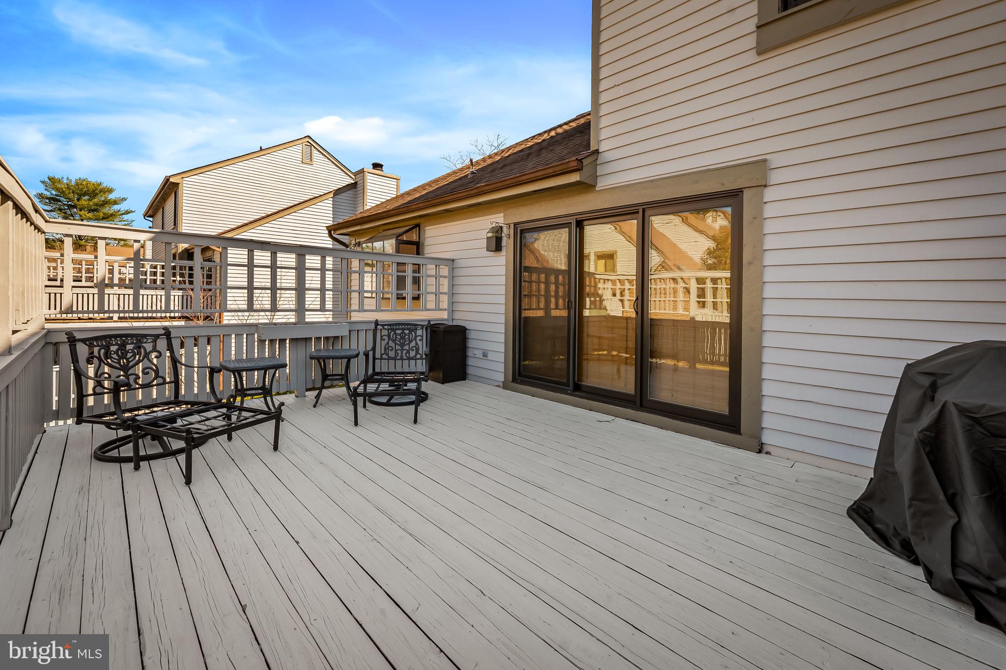 8014 Melody Lane, Unit 8014 Baltimore, MD 21208 - Photo 49 of 51 a view of living room and deck with wooden floor and fence