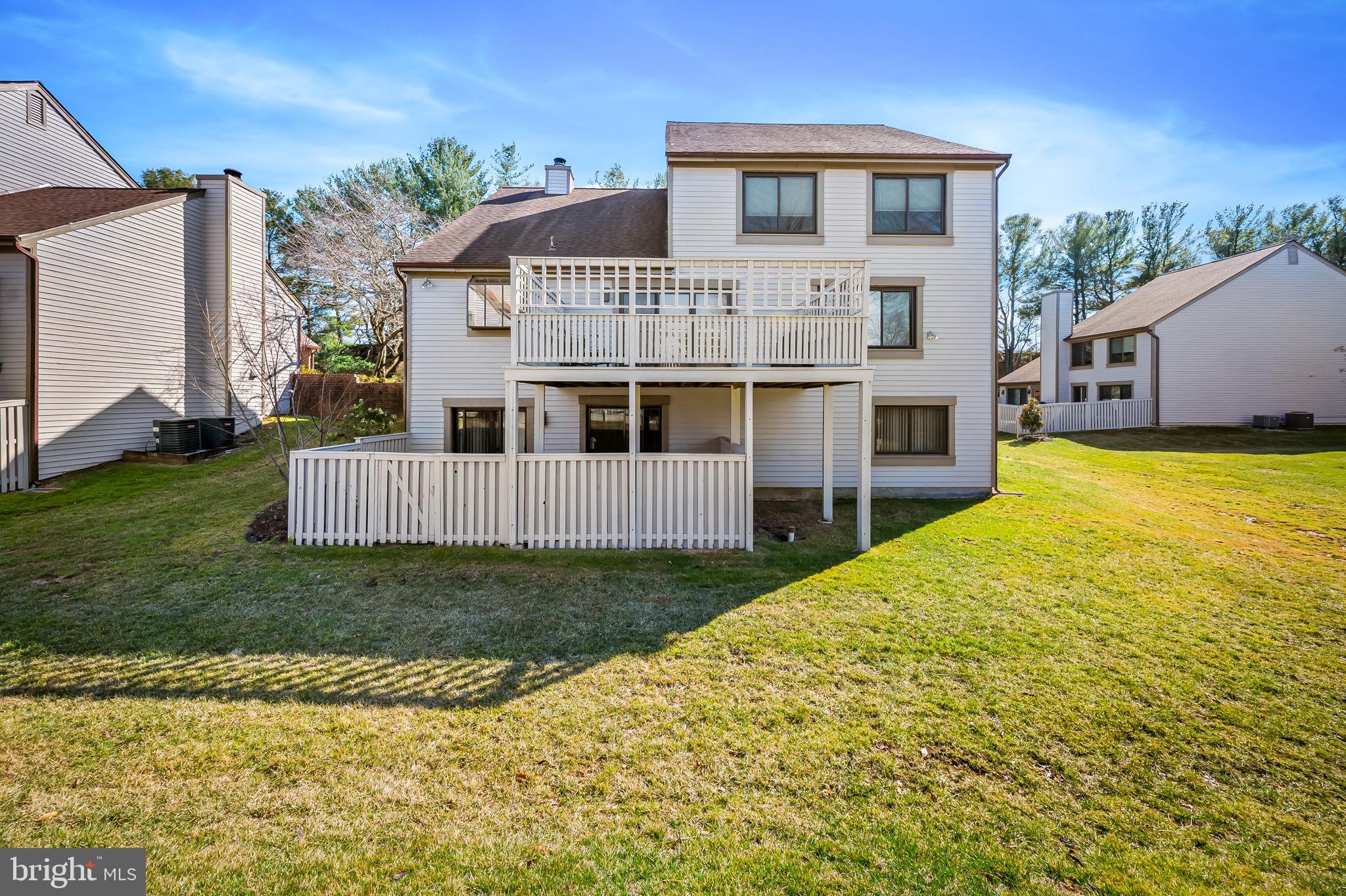 8014 Melody Lane, Unit 8014 Baltimore, MD 21208 - Photo 50 of 51 a view of a house with a yard and fence