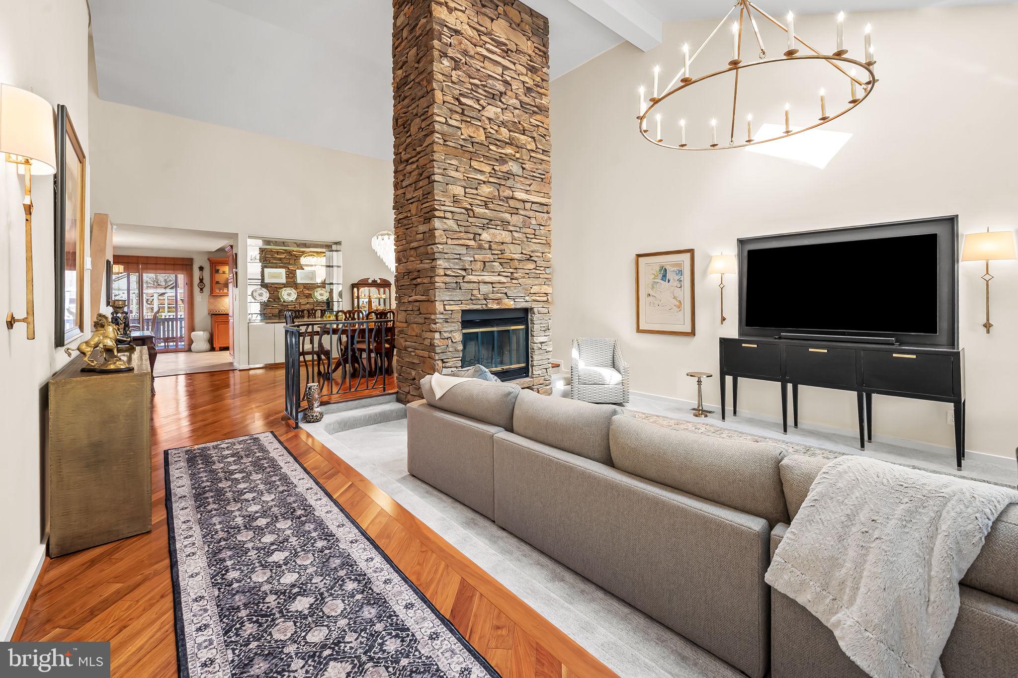 8014 Melody Lane, Unit 8014 Baltimore, MD 21208 - Photo 7 of 51 a living room with furniture and a flat screen tv