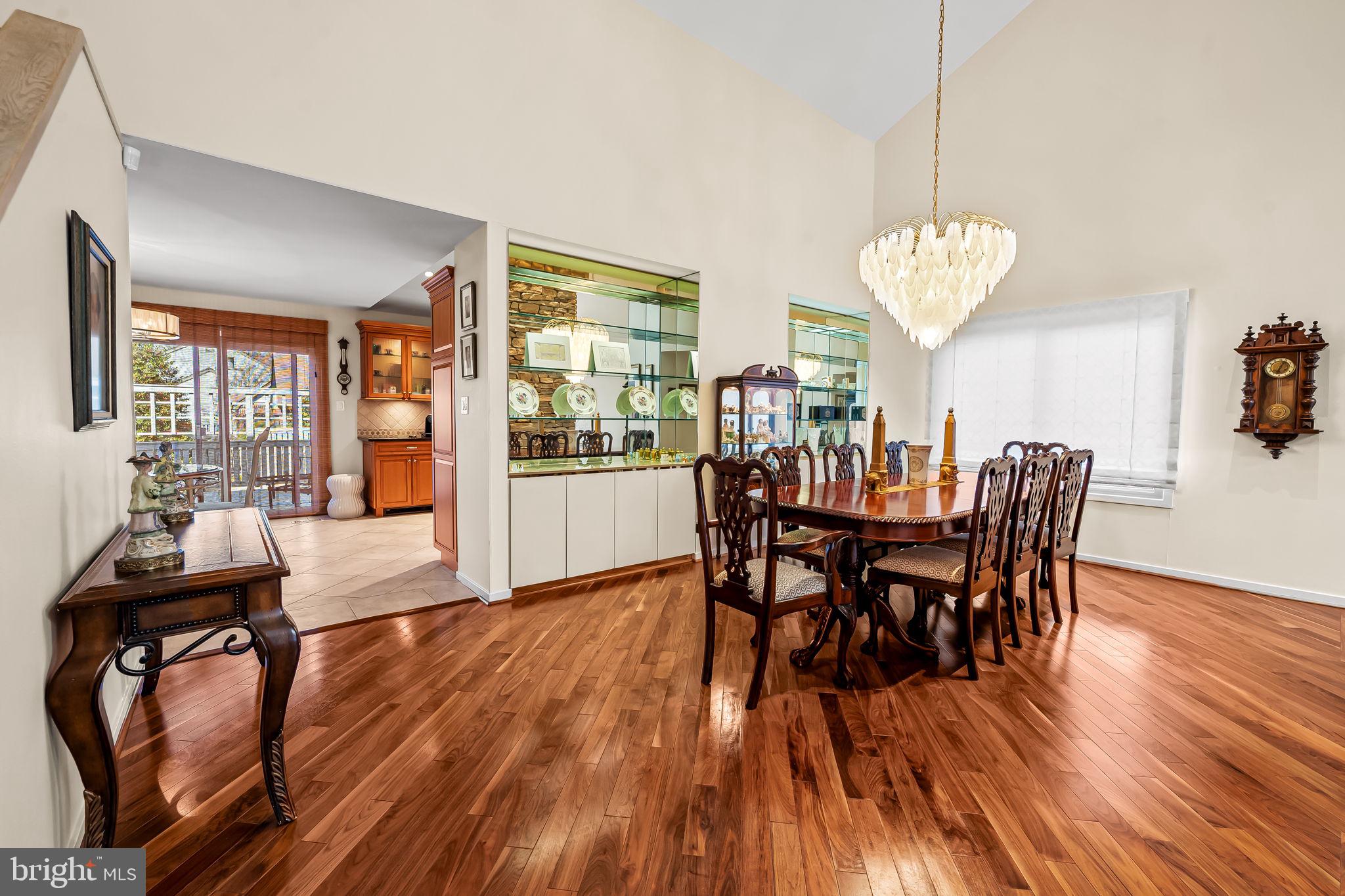 8014 Melody Lane, Unit 8014 Baltimore, MD 21208 - Photo 8 of 51 a view of a dining room with furniture window and wooden floor