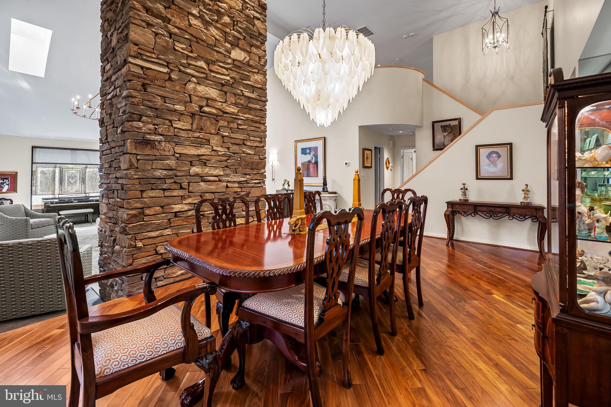 8014 Melody Lane, Unit 8014 Baltimore, MD 21208 - Photo 9 of 51 a dining room with furniture and wooden floor