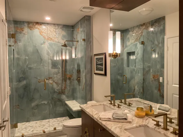 a bathroom with a granite countertop sink mirror and double