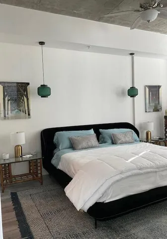 a bedroom with bed and window