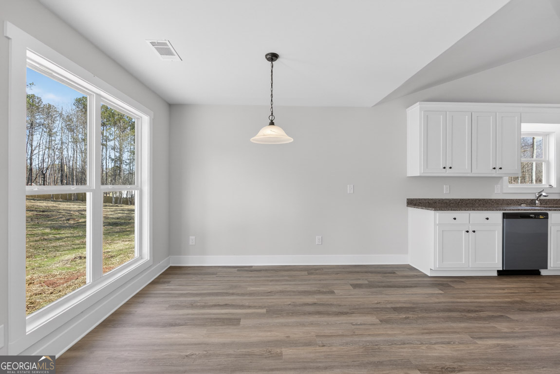 230 Airport Road, Unit 9 Canon, GA 30520 - Photo 12 of 36 a view of a kitchen with wooden floor and a window
