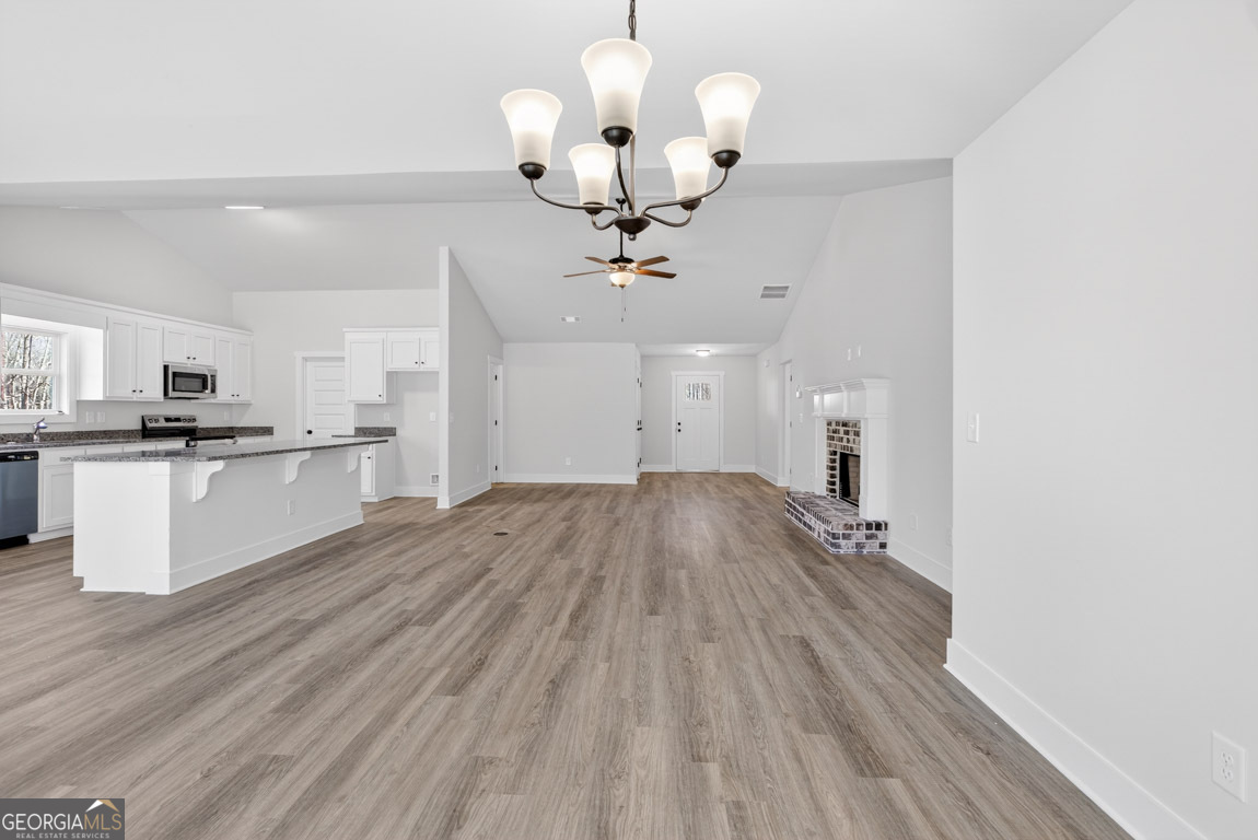 230 Airport Road, Unit 9 Canon, GA 30520 - Photo 8 of 36 a view of a kitchen with sink and wooden floor
