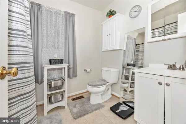 a view of an empty room with a closet