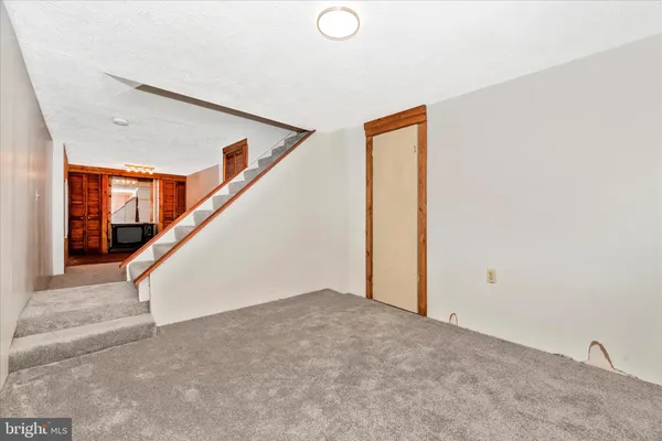 a view of a storage & utility room with a sink