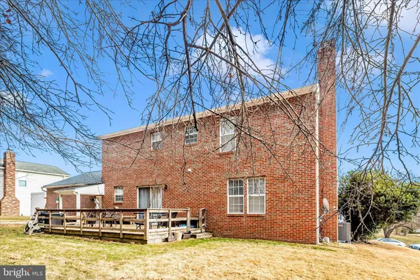 a view of house with outdoor space and seating area