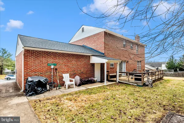 a view of a backyard with a large tree