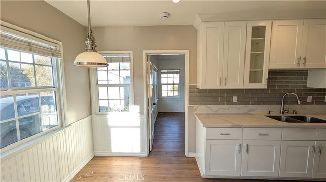 a kitchen with a sink and cabinets
