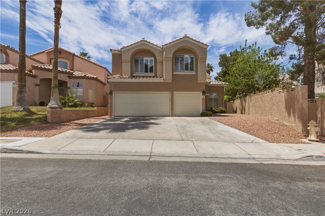 29 Olive Tree Henderson, NV 89074 - Photo 1 of 60 This residence features a well-maintained exterior, offering a welcoming facade with a dual garage entrance.