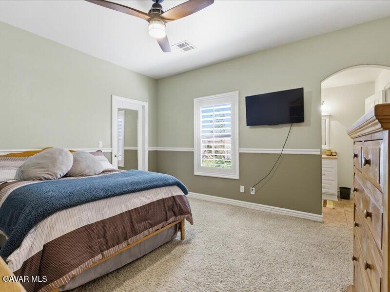 4107 Paddock Way Lancaster, CA 93536 - Photo 19 of 49 a bedroom with a bed and a window