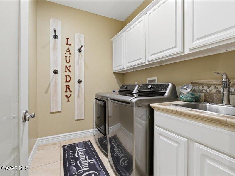 4107 Paddock Way Lancaster, CA 93536 - Photo 24 of 49 a kitchen with a refrigerator and cabinets