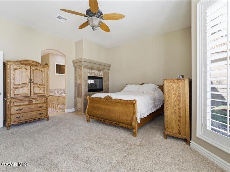 4107 Paddock Way Lancaster, CA 93536 - Photo 26 of 49 a bedroom with a bed a dresser and a window