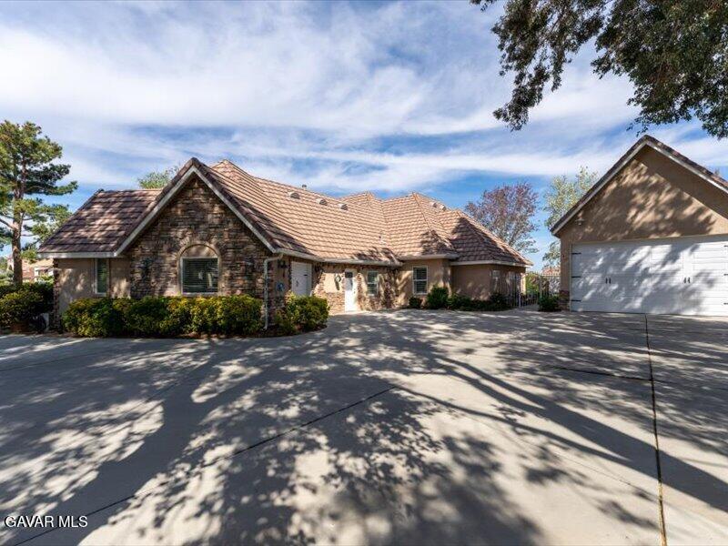 4107 Paddock Way Lancaster, CA 93536 - Photo 3 of 49 a view of a house with a yard