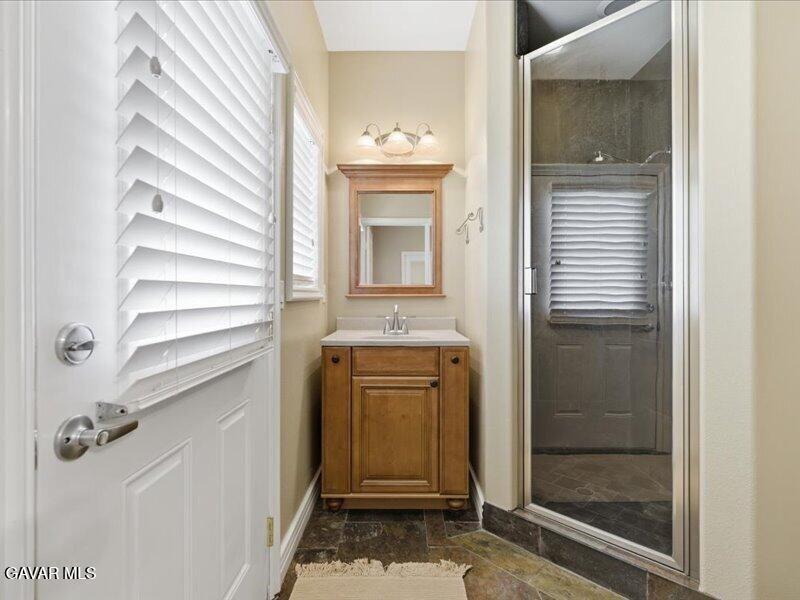 4107 Paddock Way Lancaster, CA 93536 - Photo 32 of 49 a bathroom with a sink and a mirror