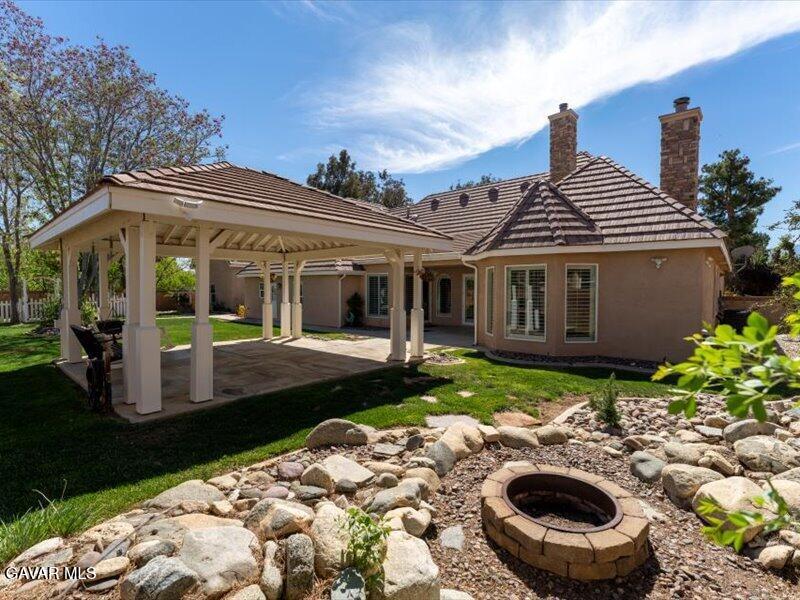 4107 Paddock Way Lancaster, CA 93536 - Photo 36 of 49 a view of a house with backyard and sitting area