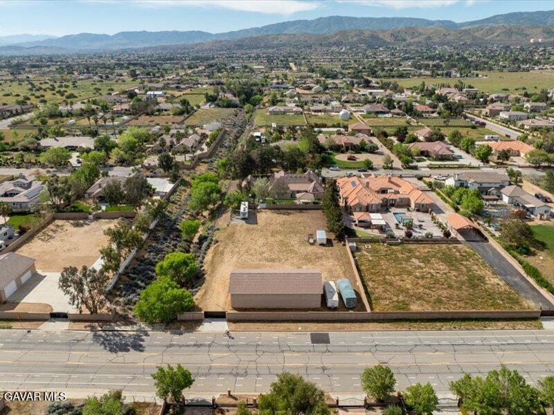 4107 Paddock Way Lancaster, CA 93536 - Photo 44 of 49 an aerial view of residential houses with outdoor space and parking