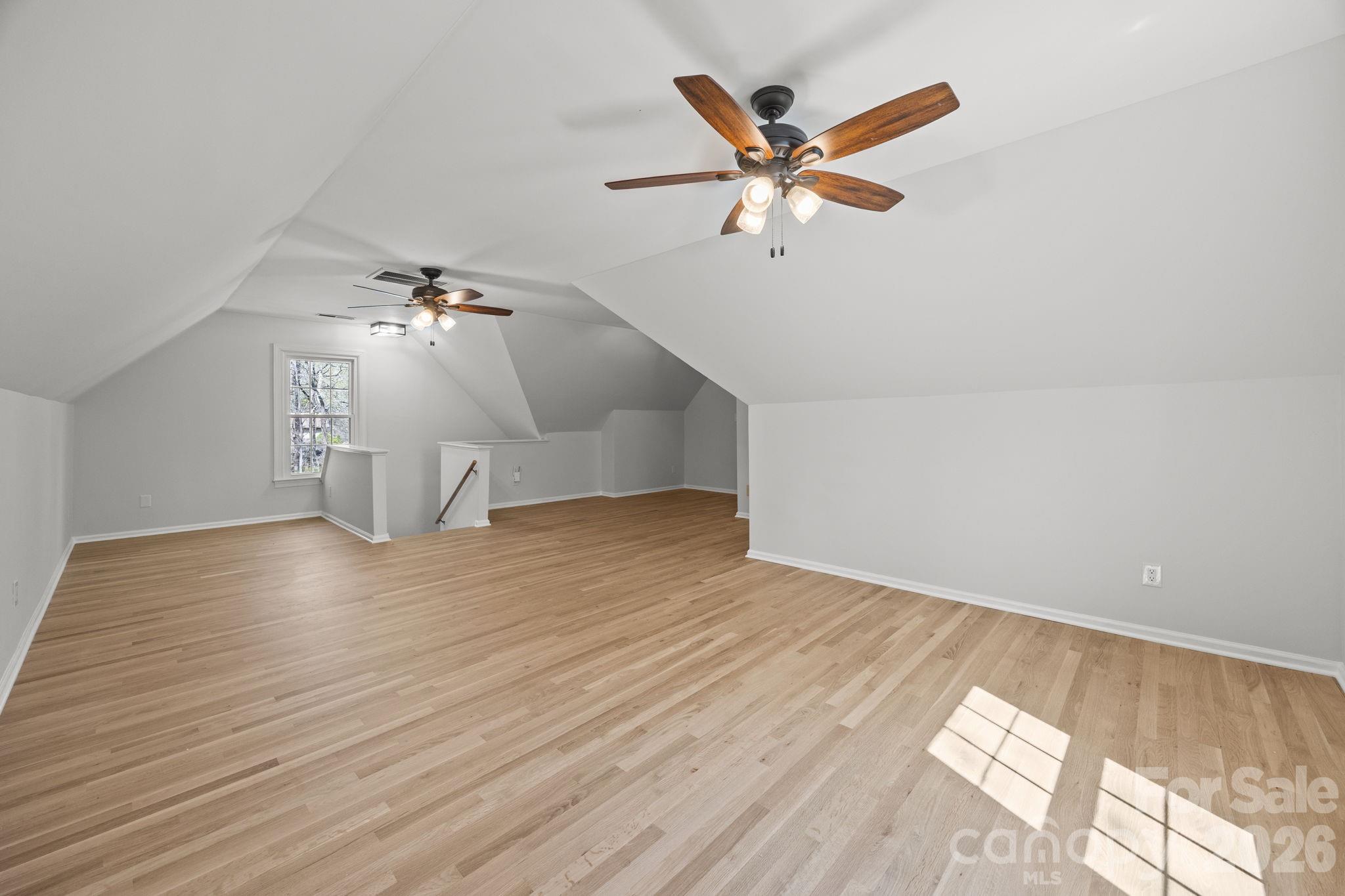 5243 Mintridge Road Mint Hill, NC 28227 - Photo 34 of 43 an empty room with wooden floor fan and windows