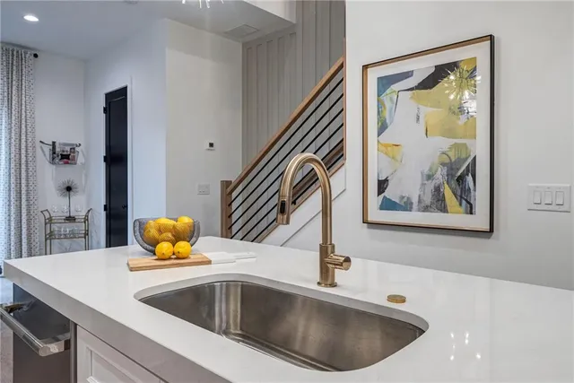 a living room with furniture a chandelier and a fireplace