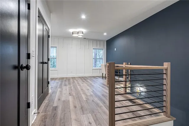 a view of a wooden fence and trees