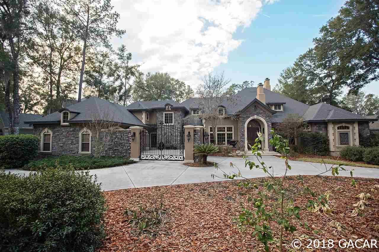 4626 Southwest 97th Terrace Gainesville, FL 32608 - Photo 1 of 30 Elegant Estate home with Stone accent and a circular driveway. Home is built with steel studs throughout.