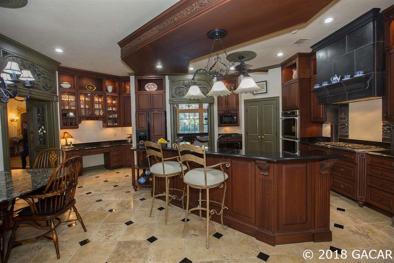 4626 Southwest 97th Terrace Gainesville, FL 32608 - Photo 11 of 30 Expansive counter space makes this room perfect for entertaining friends and family.
