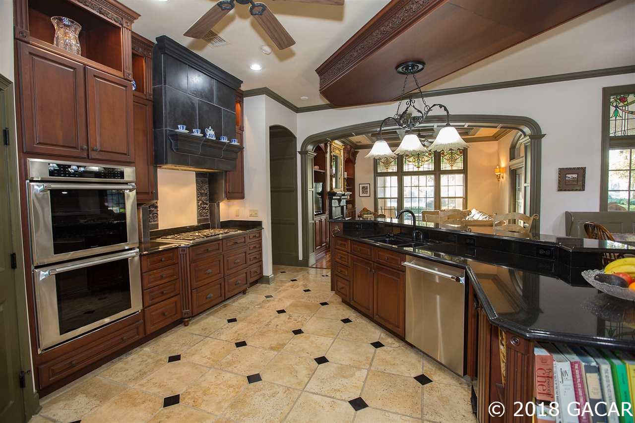 4626 Southwest 97th Terrace Gainesville, FL 32608 - Photo 13 of 30 New stainless steel appliances including Thermador double convection oven and a six burner gas cooktop.