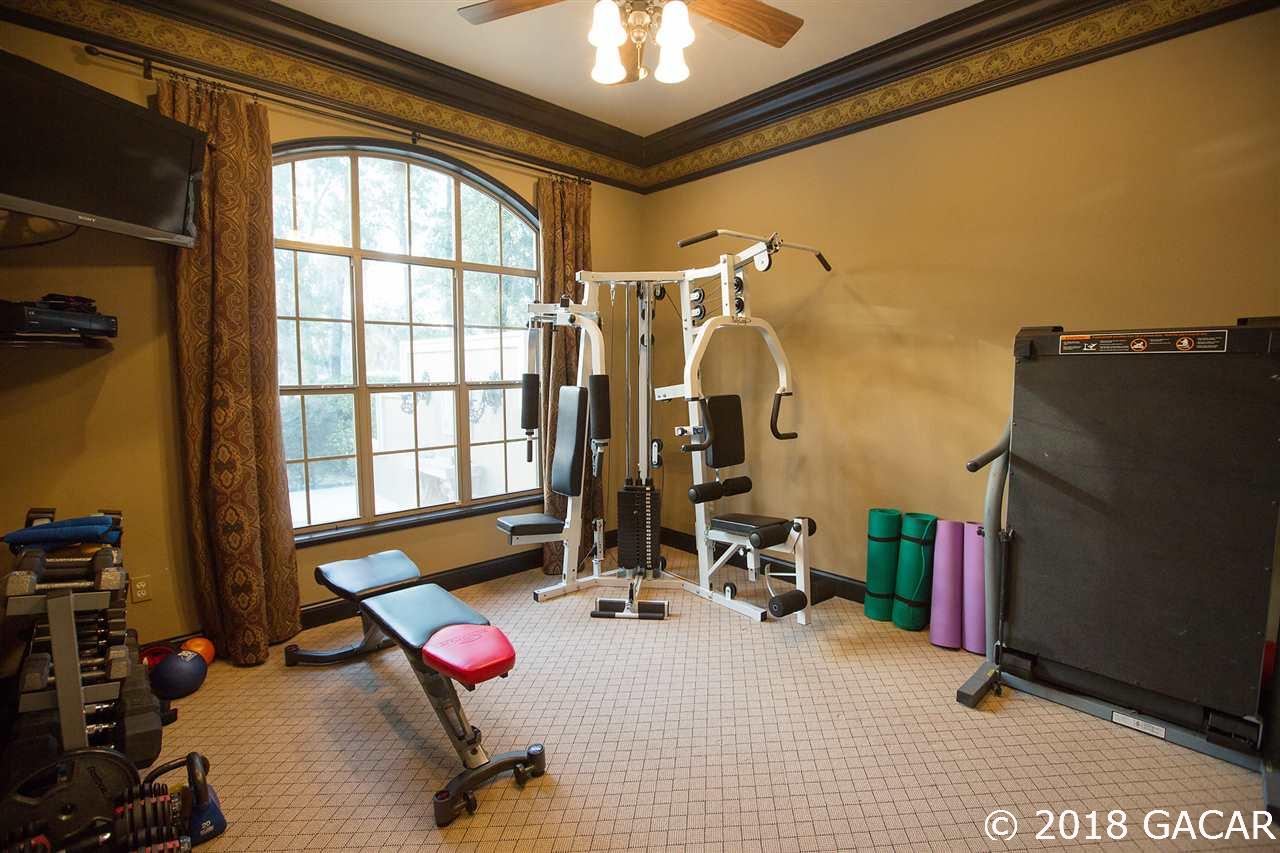 4626 Southwest 97th Terrace Gainesville, FL 32608 - Photo 18 of 30 Who wouldn't love their own exercise room off their Master Suite? This room is large, convenient and the perfect flex space.