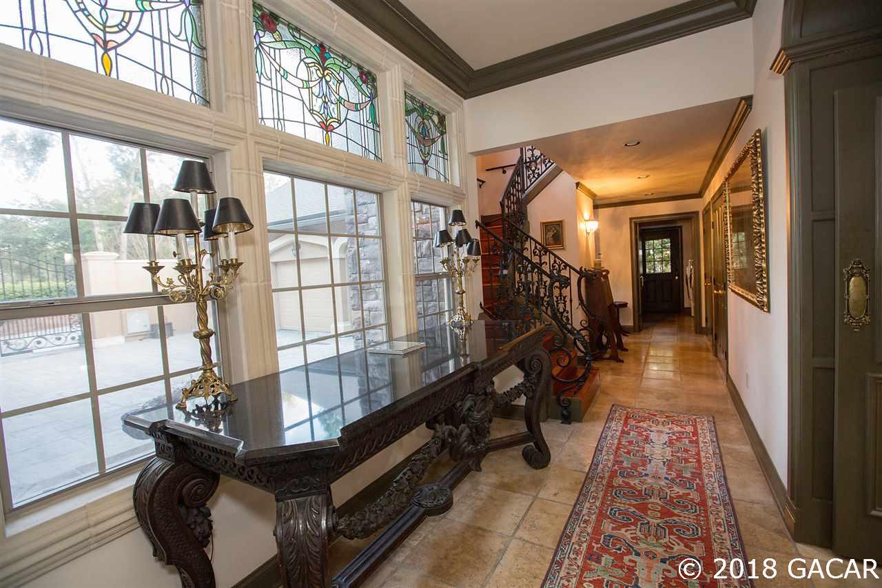 4626 Southwest 97th Terrace Gainesville, FL 32608 - Photo 22 of 30 This hallway features stained glass windows imported from England and a stairwell completed with imported wrought ironwork from Italy.