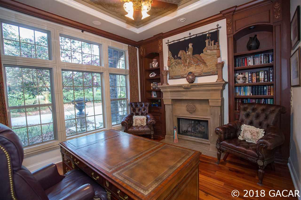 4626 Southwest 97th Terrace Gainesville, FL 32608 - Photo 24 of 30 The study features 4 built-ins and a stone fireplace.