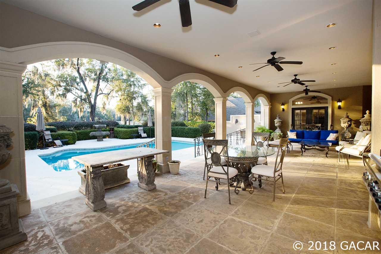 4626 Southwest 97th Terrace Gainesville, FL 32608 - Photo 25 of 30 The expansive Lanai overlooks the heated pool and the 10th Fairway.
