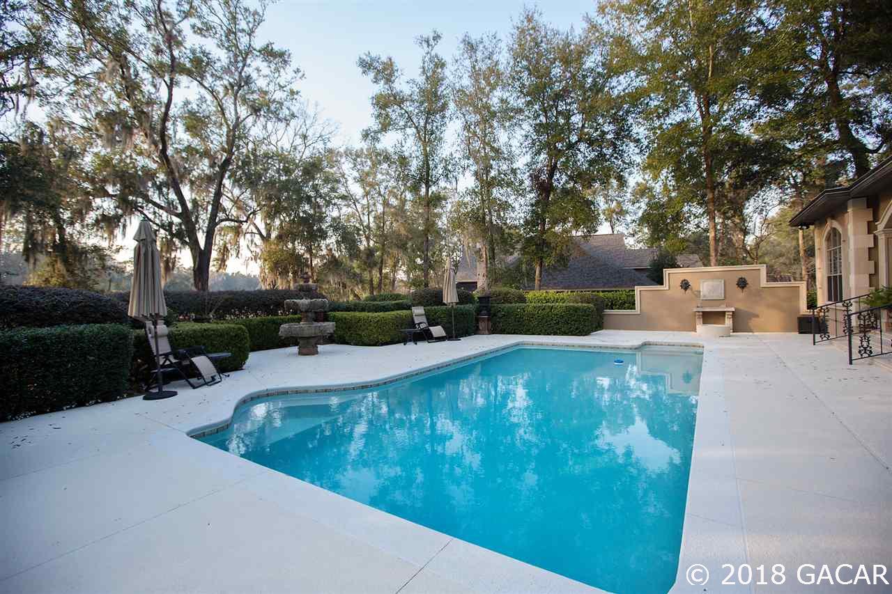 4626 Southwest 97th Terrace Gainesville, FL 32608 - Photo 26 of 30 Large heated swimming pool is an ideal place to cool off after a long day.