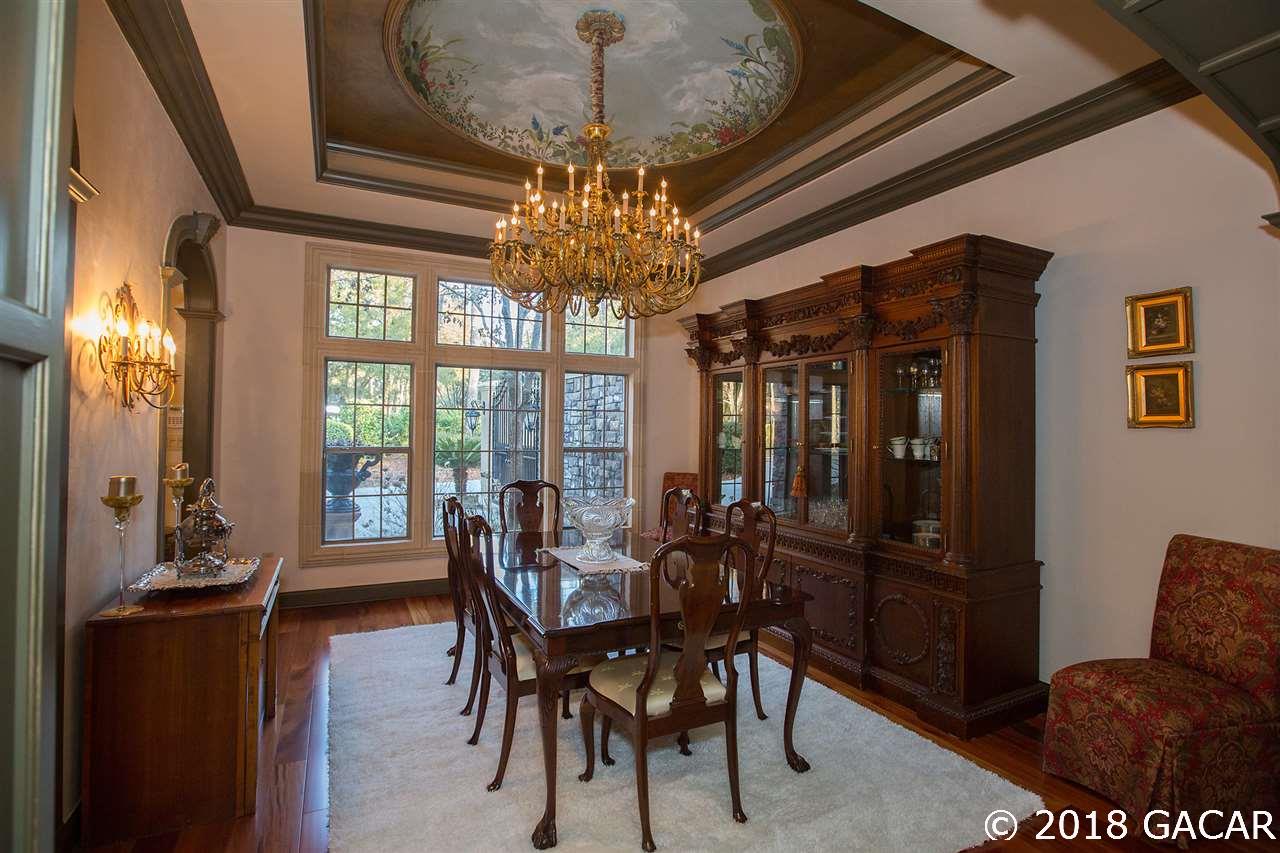 4626 Southwest 97th Terrace Gainesville, FL 32608 - Photo 8 of 30 Dining room with a hand painted dome ceiling and a large beautiful chandelier.