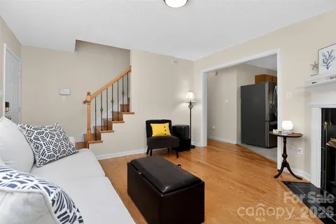 a living room with furniture and a lamp